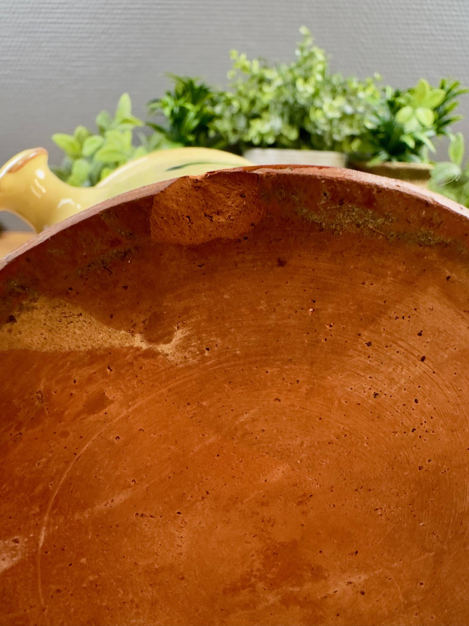 Antique ceramic pot with hand-painted floral decoration.