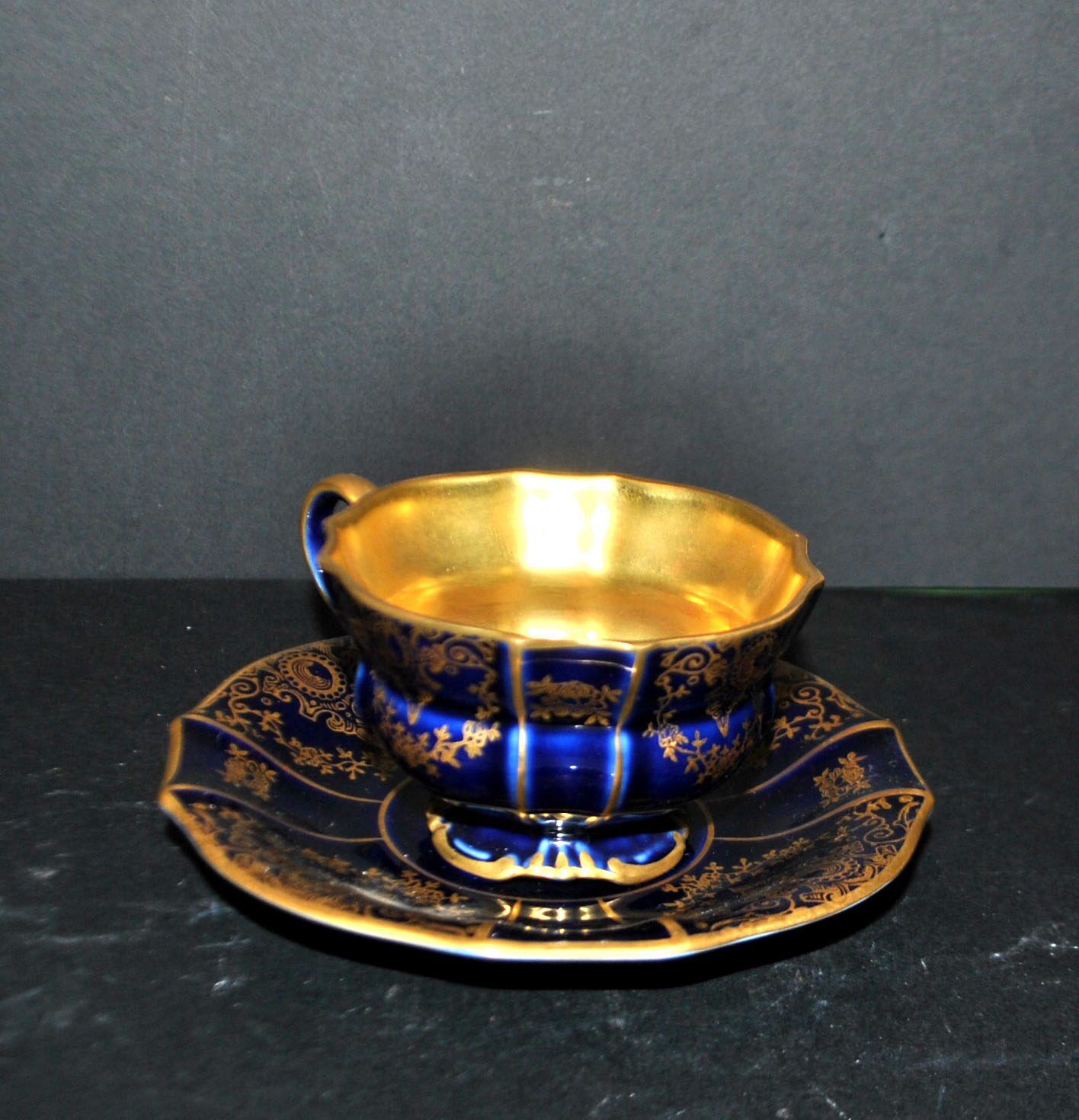 A precious, multi-lobed cup in German cobalt porcelain with a gold interior, Lindner Bavaria.