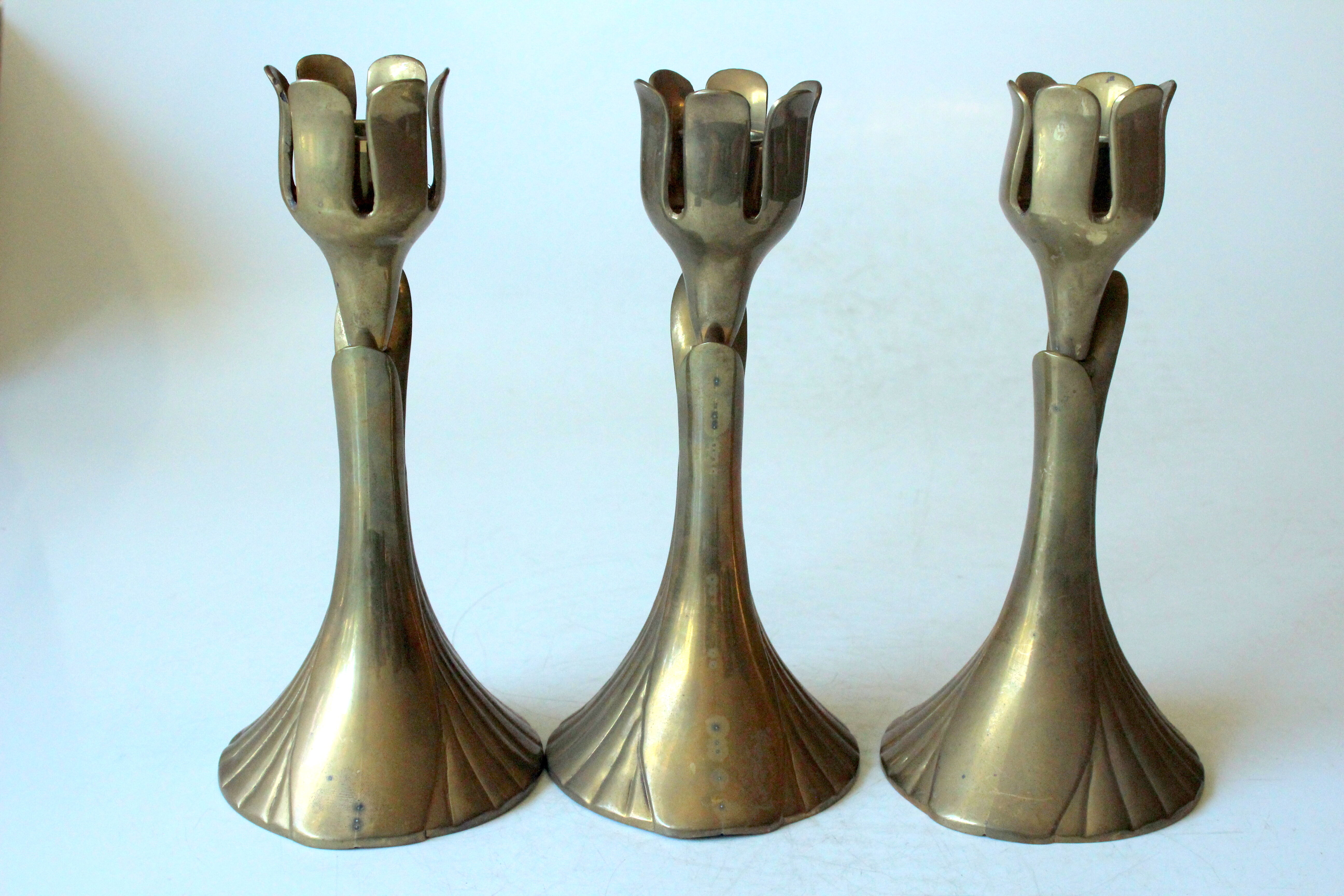 3 beautifull solid brass candle holders with floral motif, vintage from the 1960s
