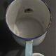 Enamelled sheet metal pourer decorated with black berries early twentieth century
