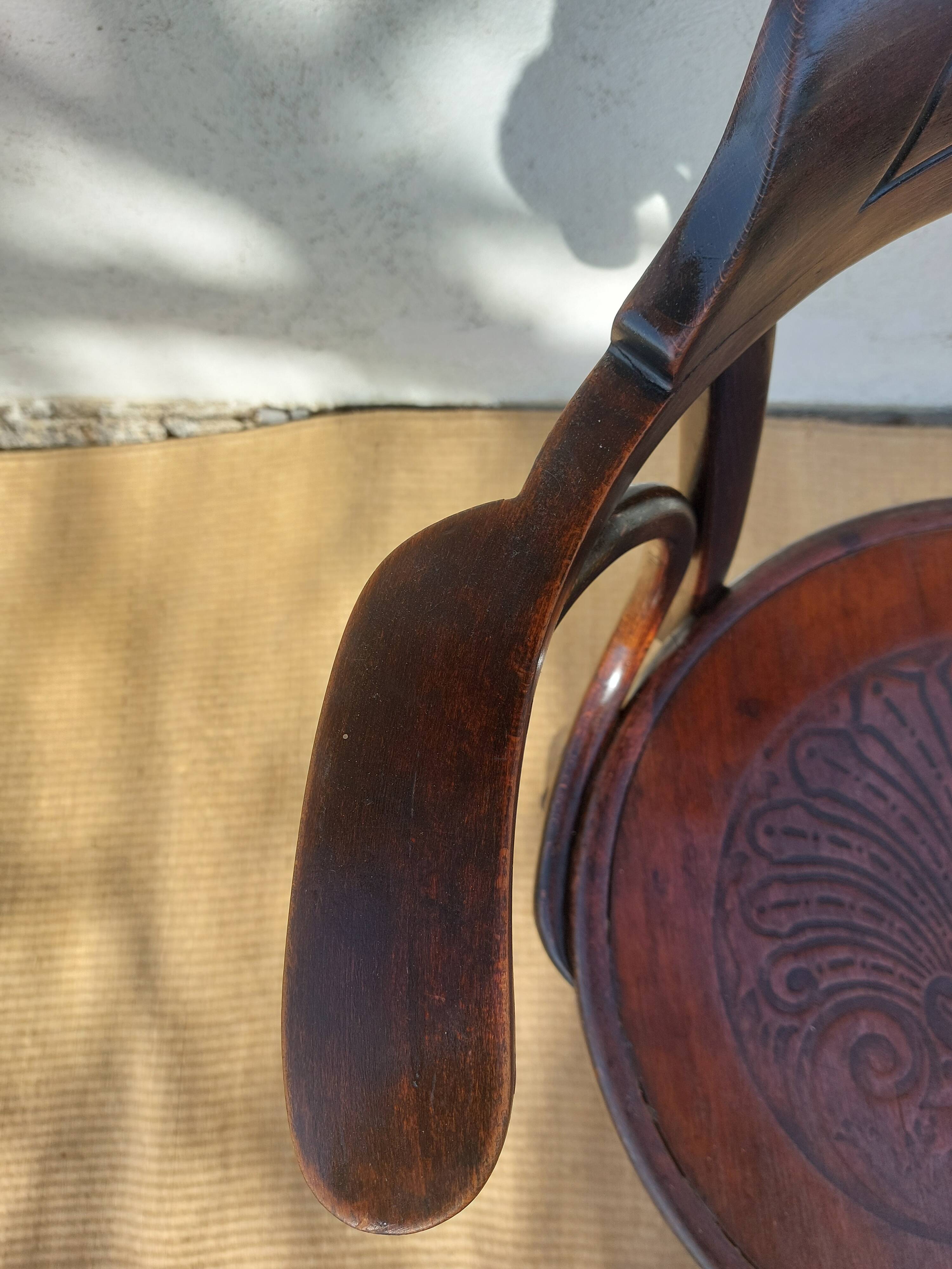 Swivel wooden armchair, pattern on seat
