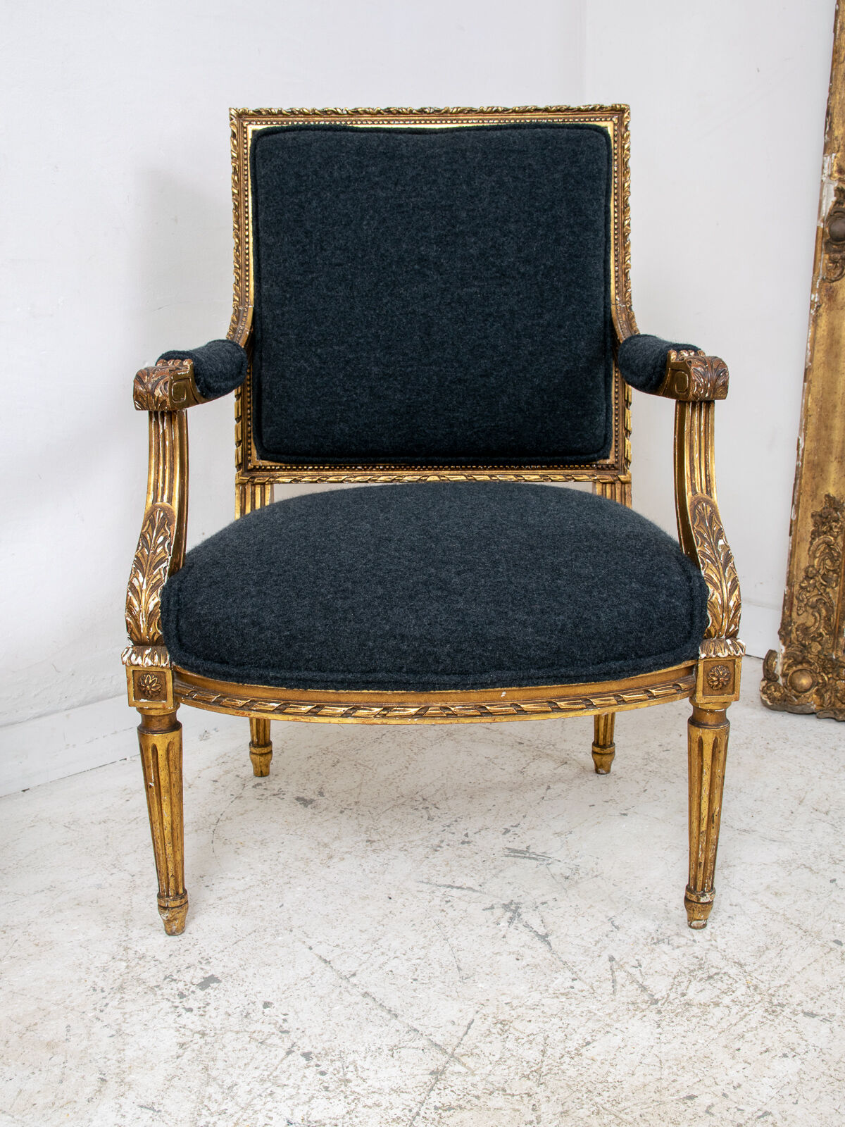 Pair of 19th century Louis XVI gilt armchairs newly re upholstered in holland and sherry fabric