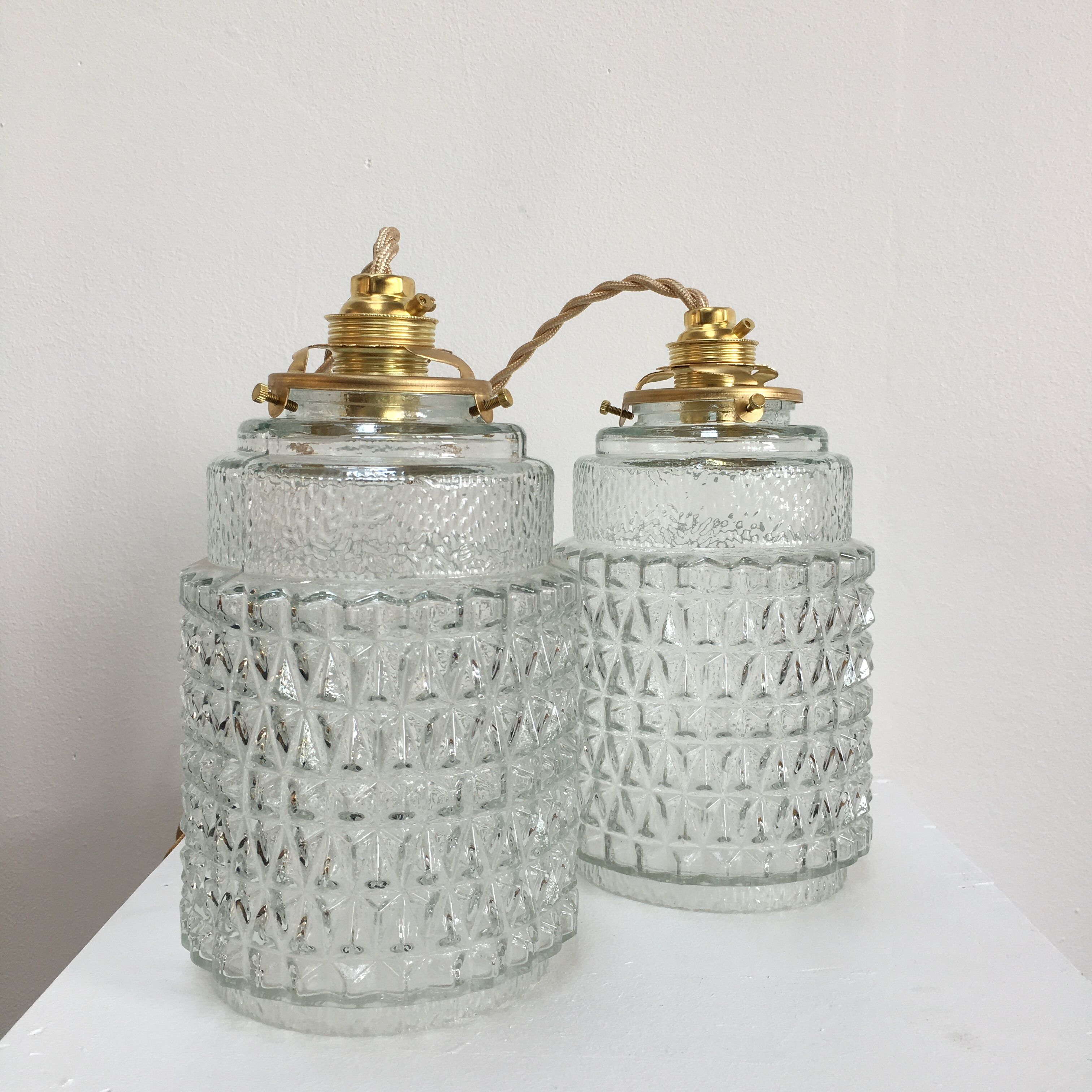 Pair of vintage molded pressed glass pendant lights