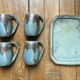 Set of 4 cups and 1 signed brutalist tray.