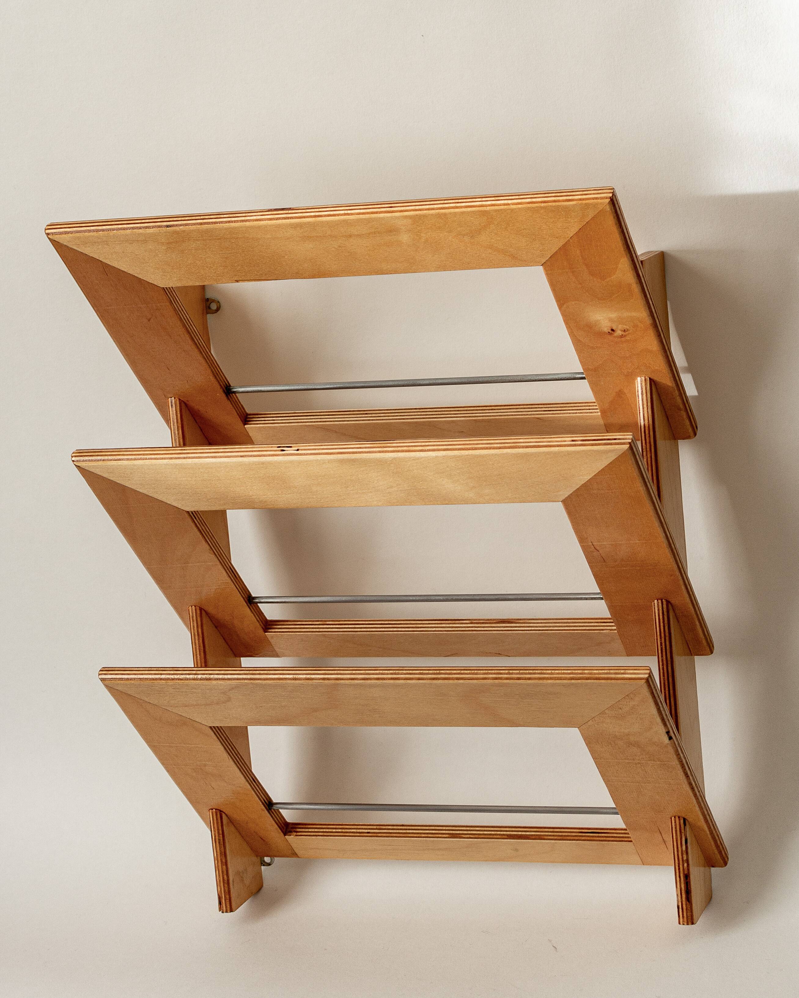 Wall-mounted magazine rack in varnished plywood, 80s/90s