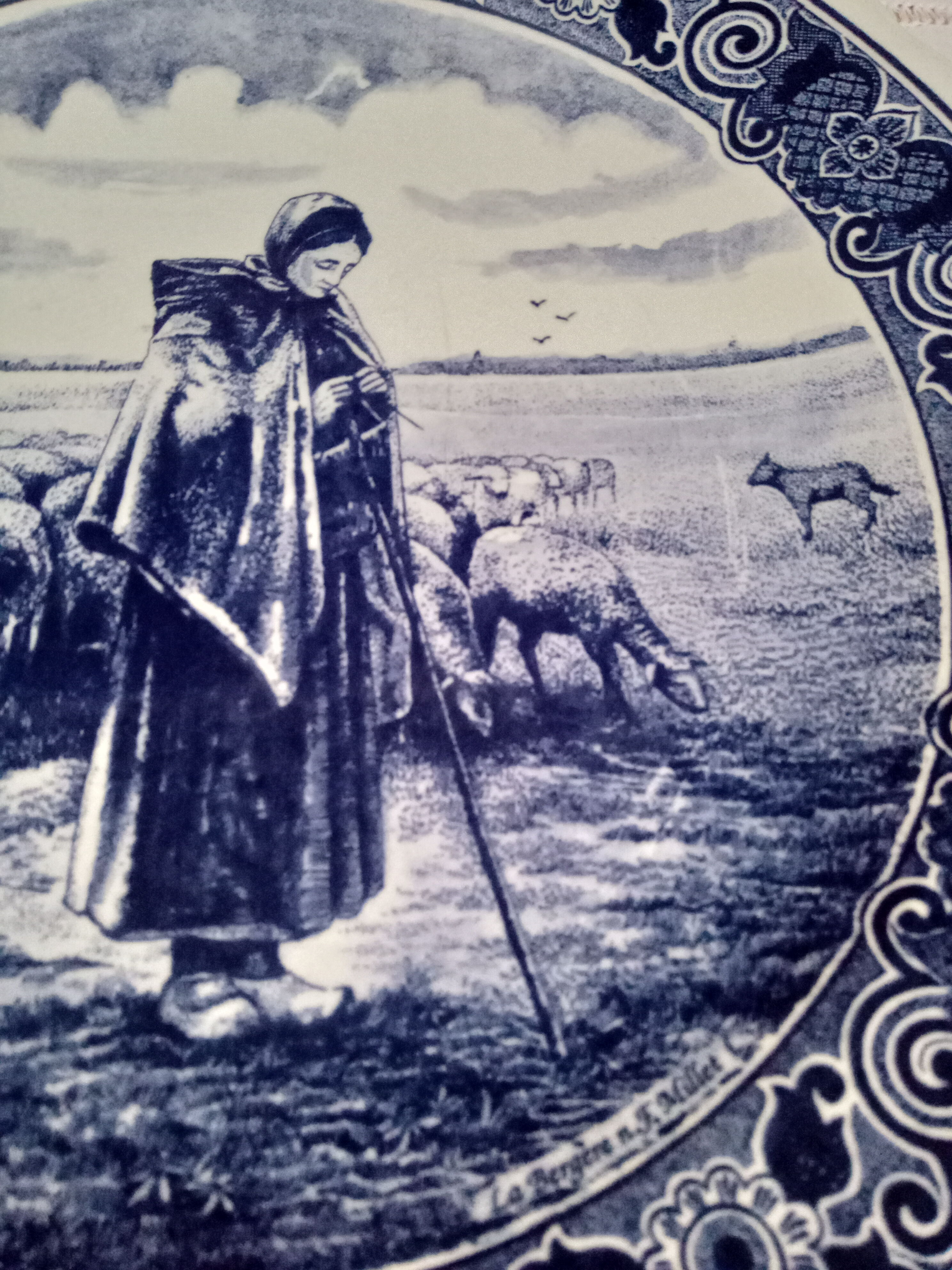 Round dish hollow Delfts decorating shepherdess and her sheep