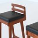 Erik Buck set of three bar stools in teak and leather Dyrlund Denmark 1960