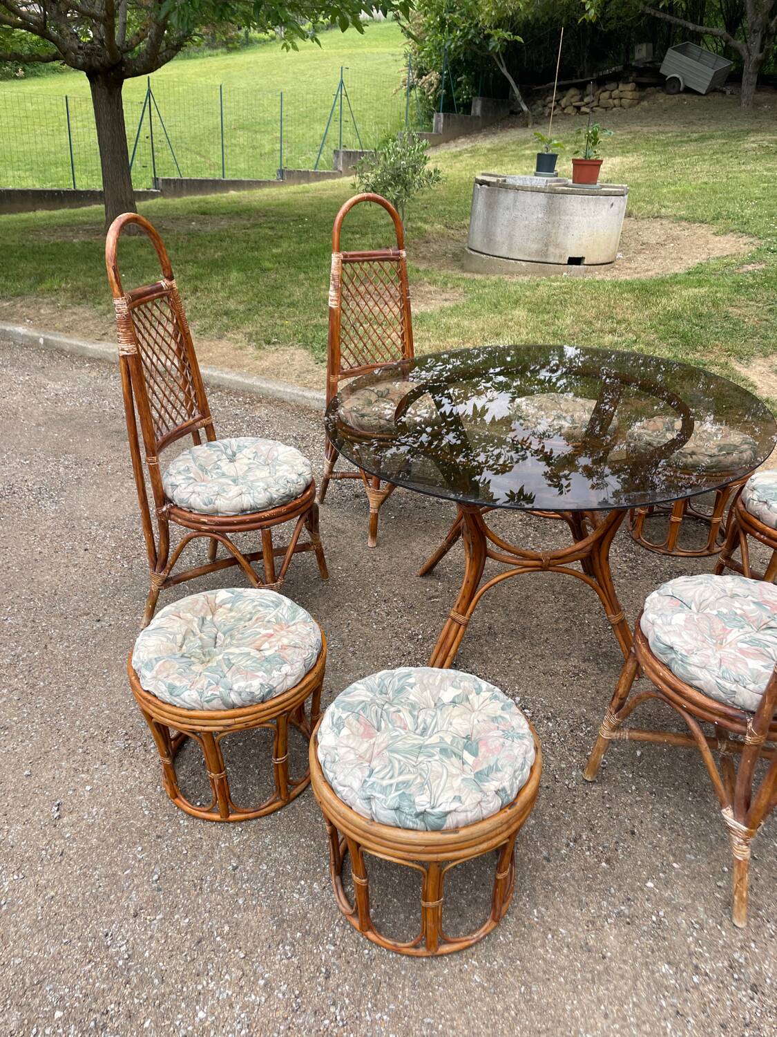 Vintage rattan dining set with glass table, 4 chairs and 4 stools.