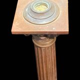 Bronze candle holder with floral motifs.
