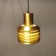 Hanging lamp in gold-colored aluminum with many layers of shades.