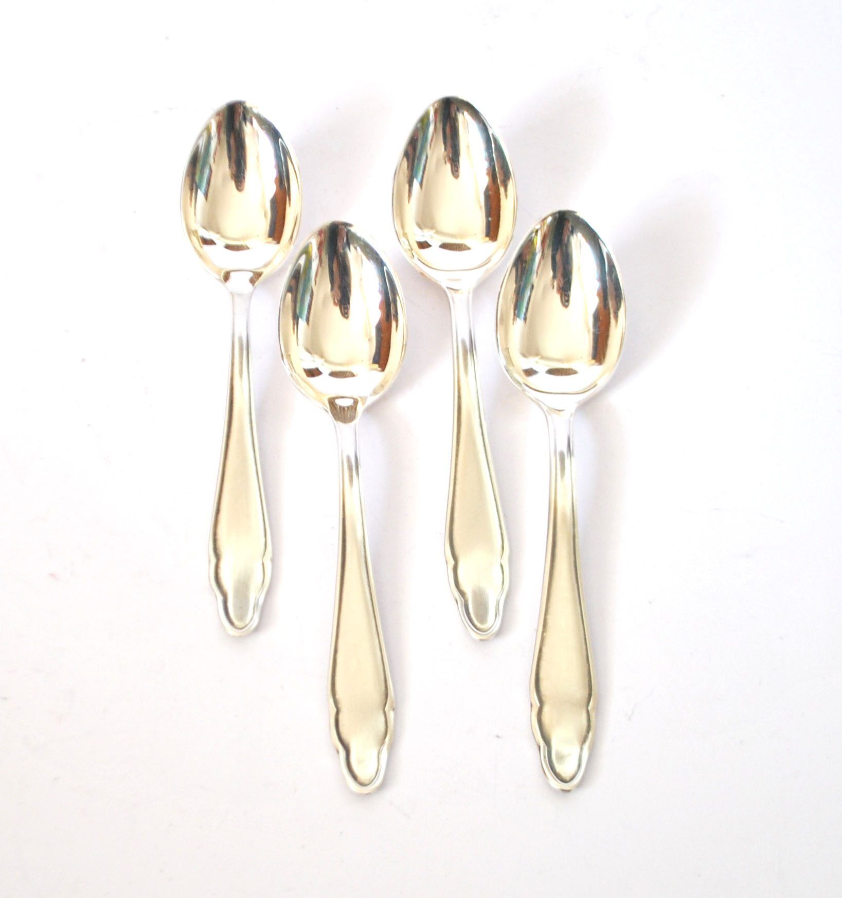DEETJEN set of 4 silver-plated dessert spoons with a modernist scalloped design.