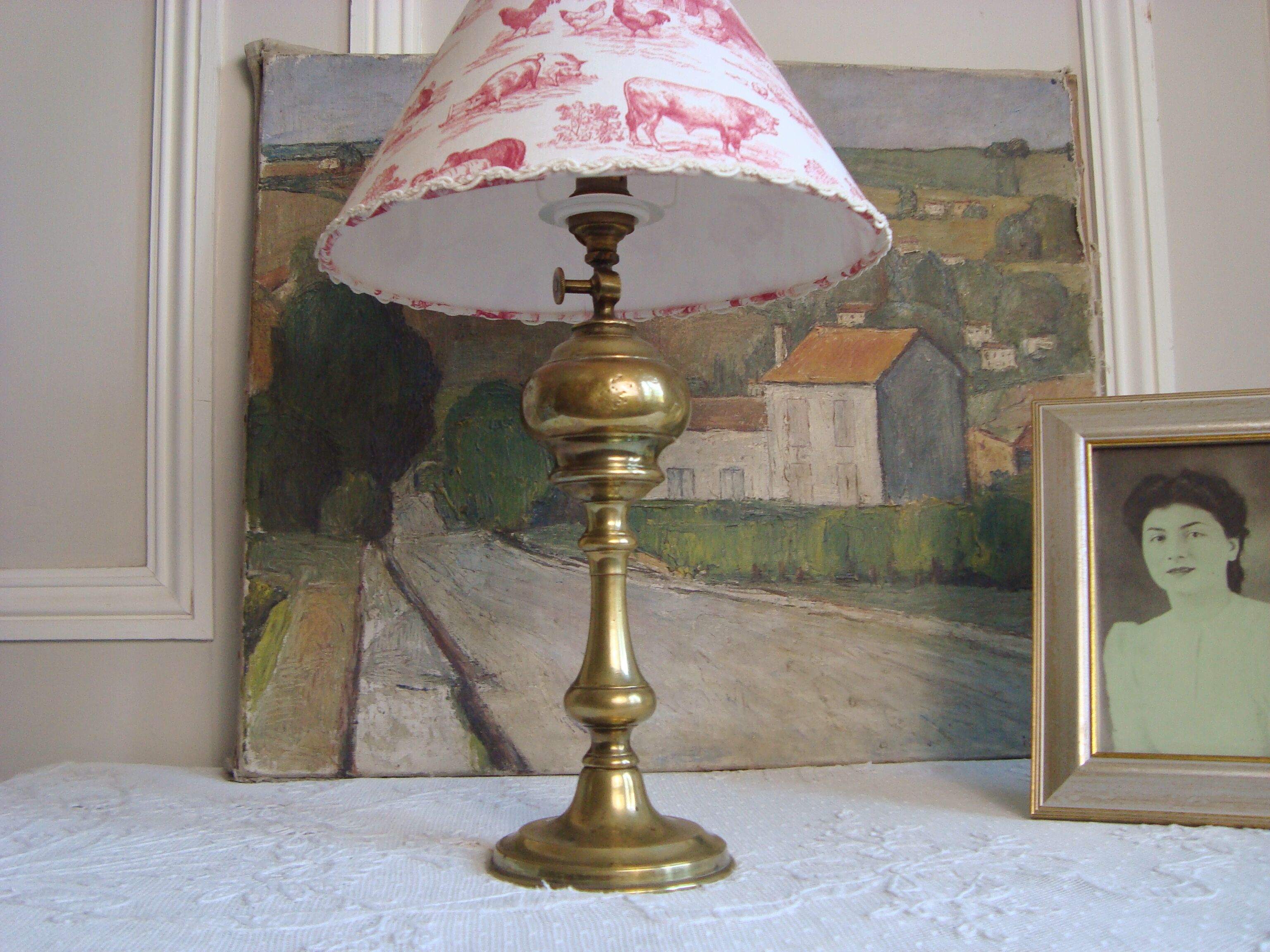 Ancient brass lamp with its youthd shade motifs farm animals