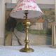 Ancient brass lamp with its youthd shade motifs farm animals