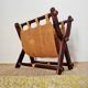 Foldable magazine rack in wood and jute fabric - brutalist