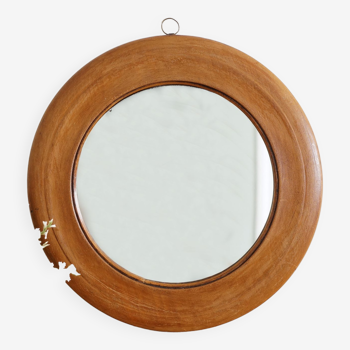 Antique round mirror with turned wooden frame
