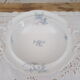 Compotier on porcelain pedestal decoration pale blue flowers