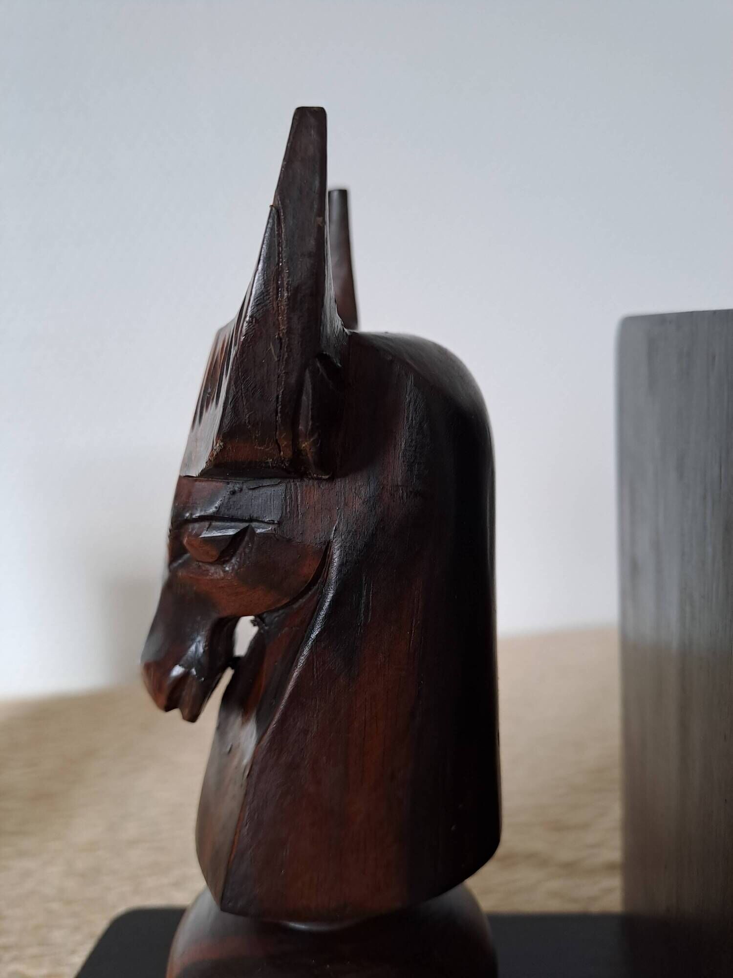 Pair of vintage wooden bookends with stylised horse heads.