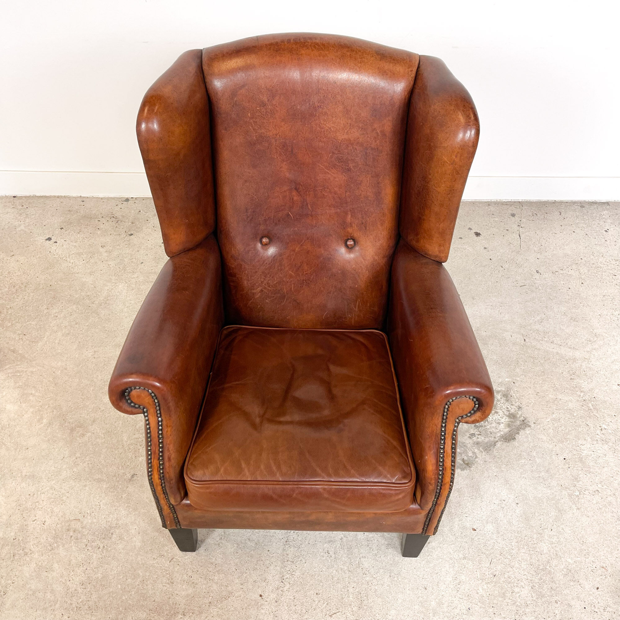 Vintage sheep leather wingback armchair by Lounge Atelier