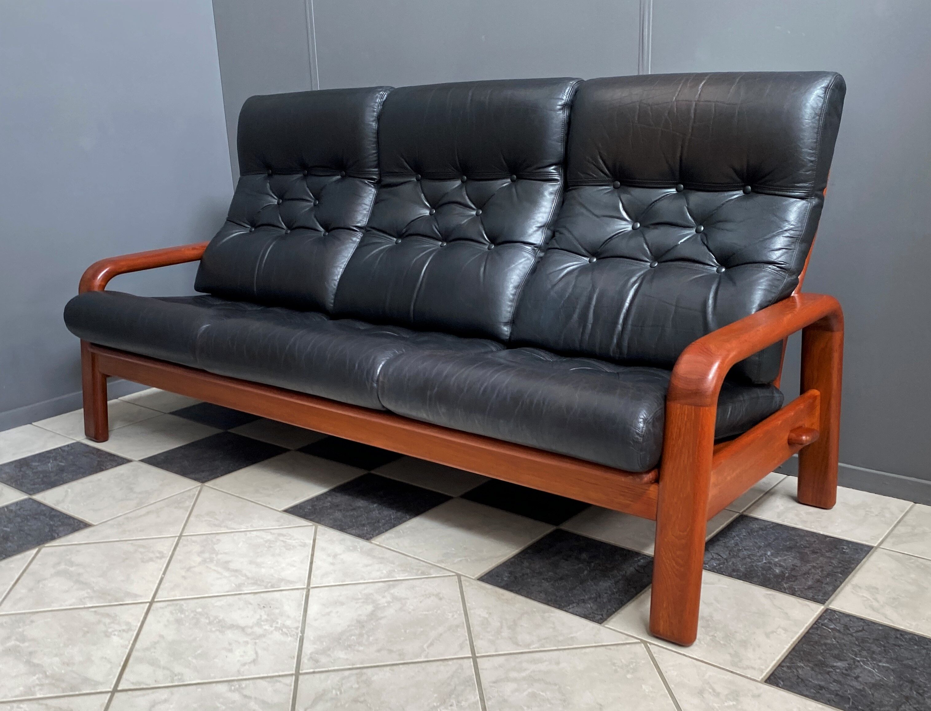 Teak and Black Leather 32 seat sofa by HS Denmark 1970s