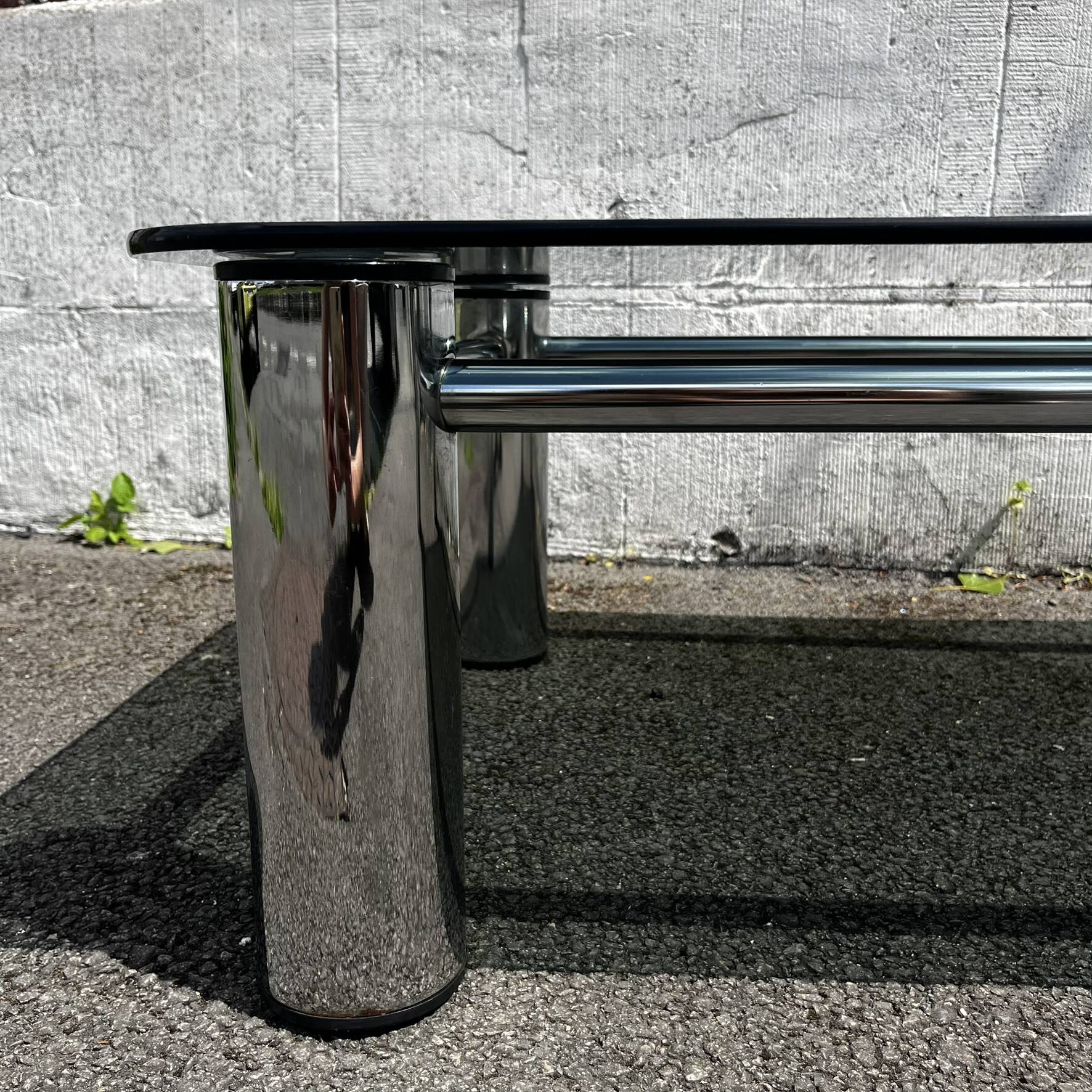Vintage coffee table with smoked glass and chrome.