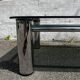 Vintage coffee table with smoked glass and chrome.