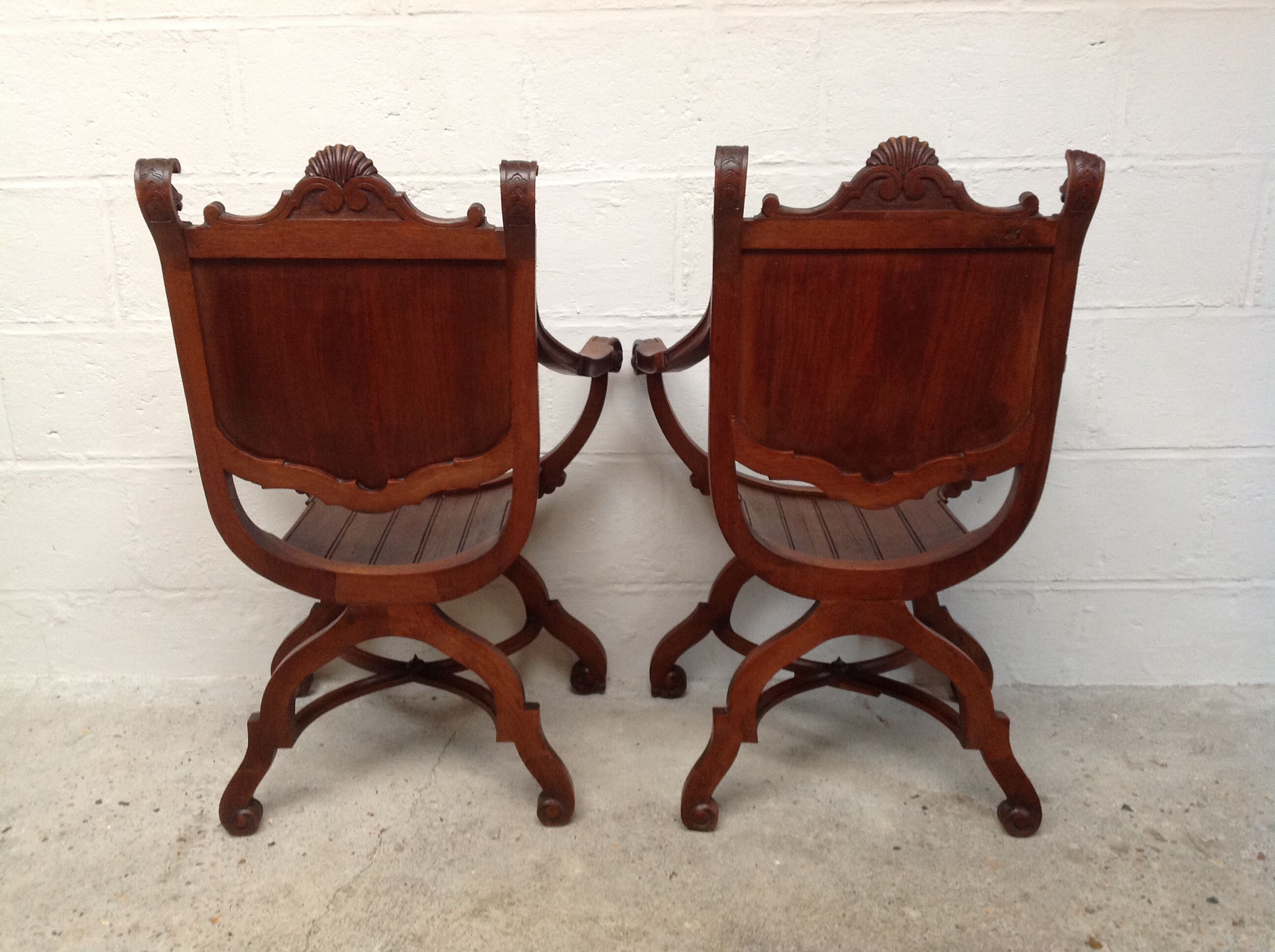 Pair of antique armchairs curules called Dagobert in carved wood