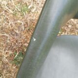 Vintage conference armchair in green skai Roset SNA