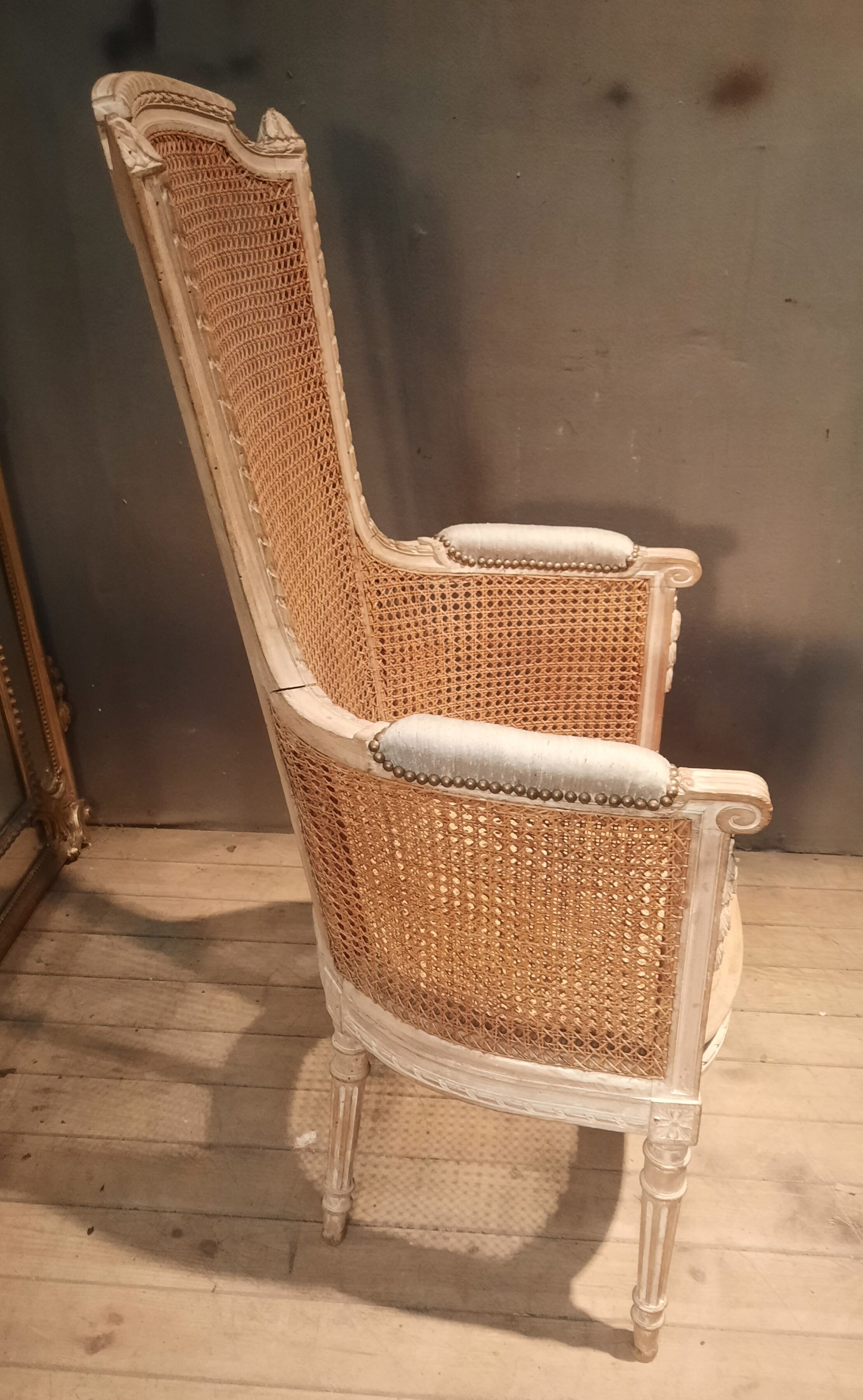 Louis XVI high-backed caned armchair