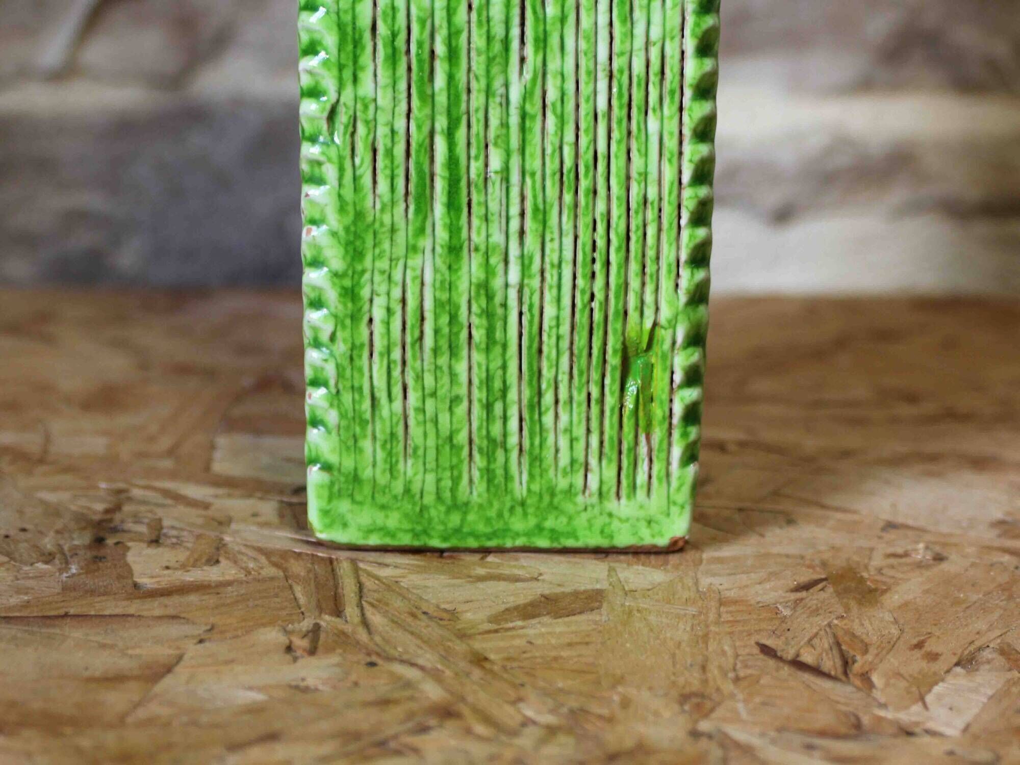 Incised ceramic vase with a square section