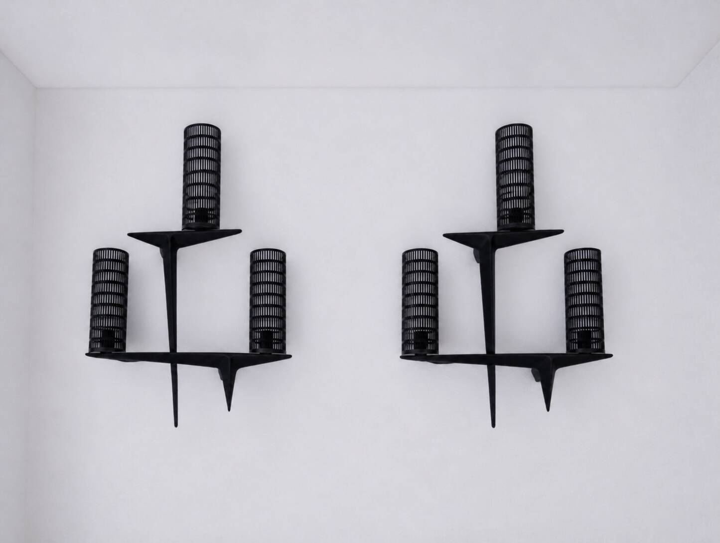 Pair of sculpted lacquered bronze wall lights, Arlus