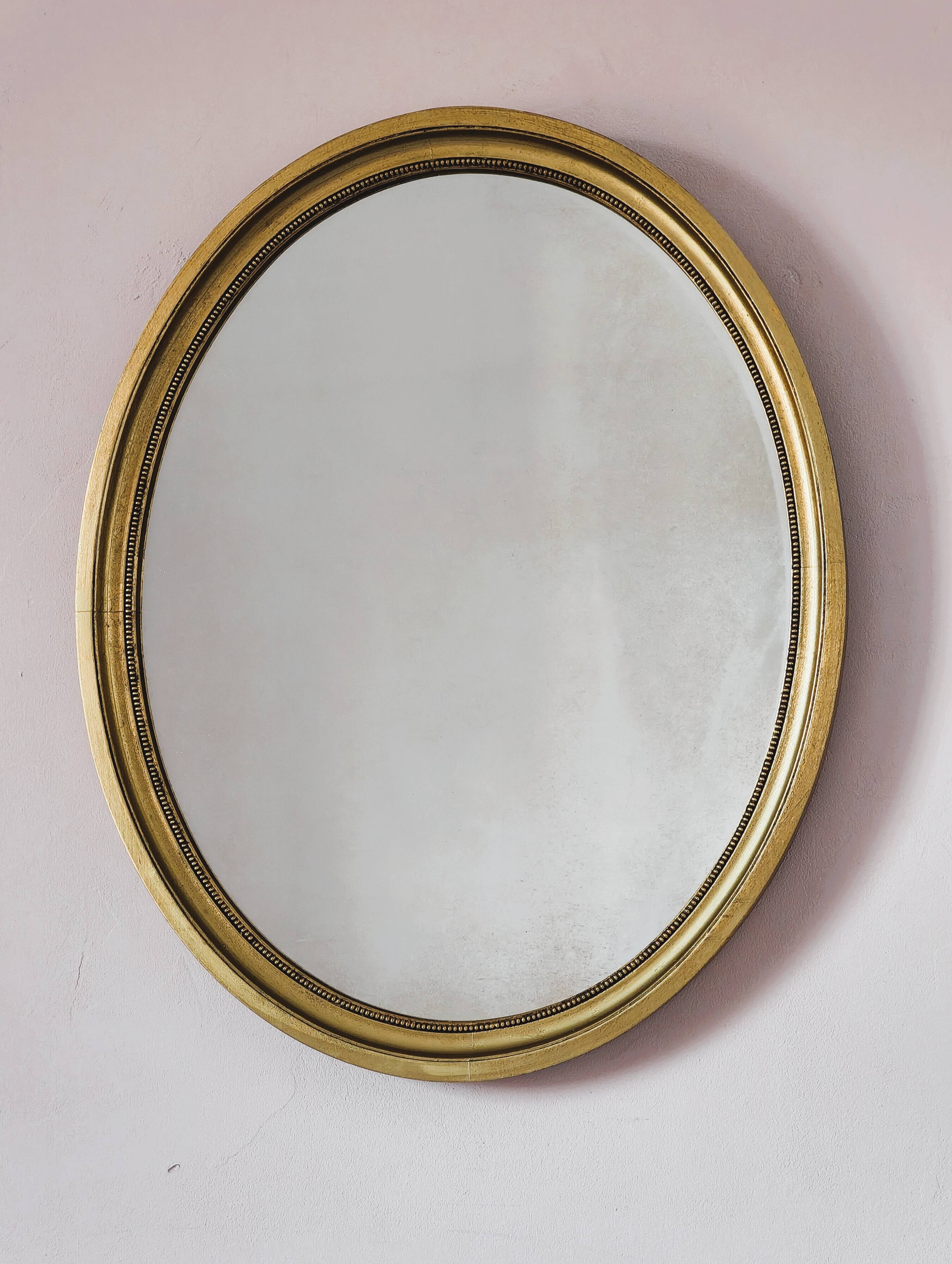 Antique gold oval mirror