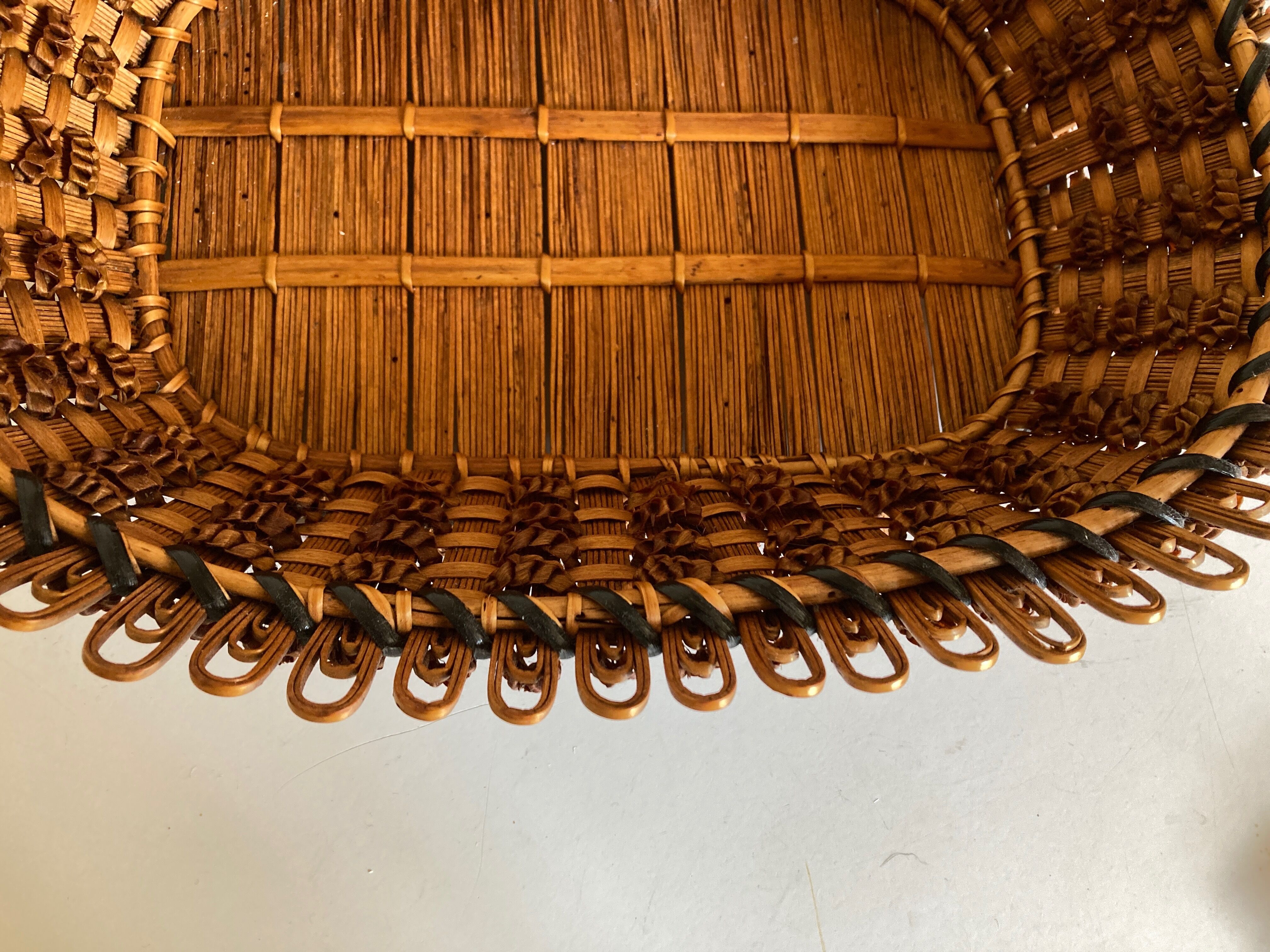 19th-century wicker basket embroidered by folk artisans.