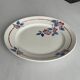 Round plate from the Céranord Saint-Amand service • Red and blue floral decoration