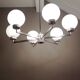 Six-light chrome metal chandelier and opaque glass globes / vintage 60s and 70s