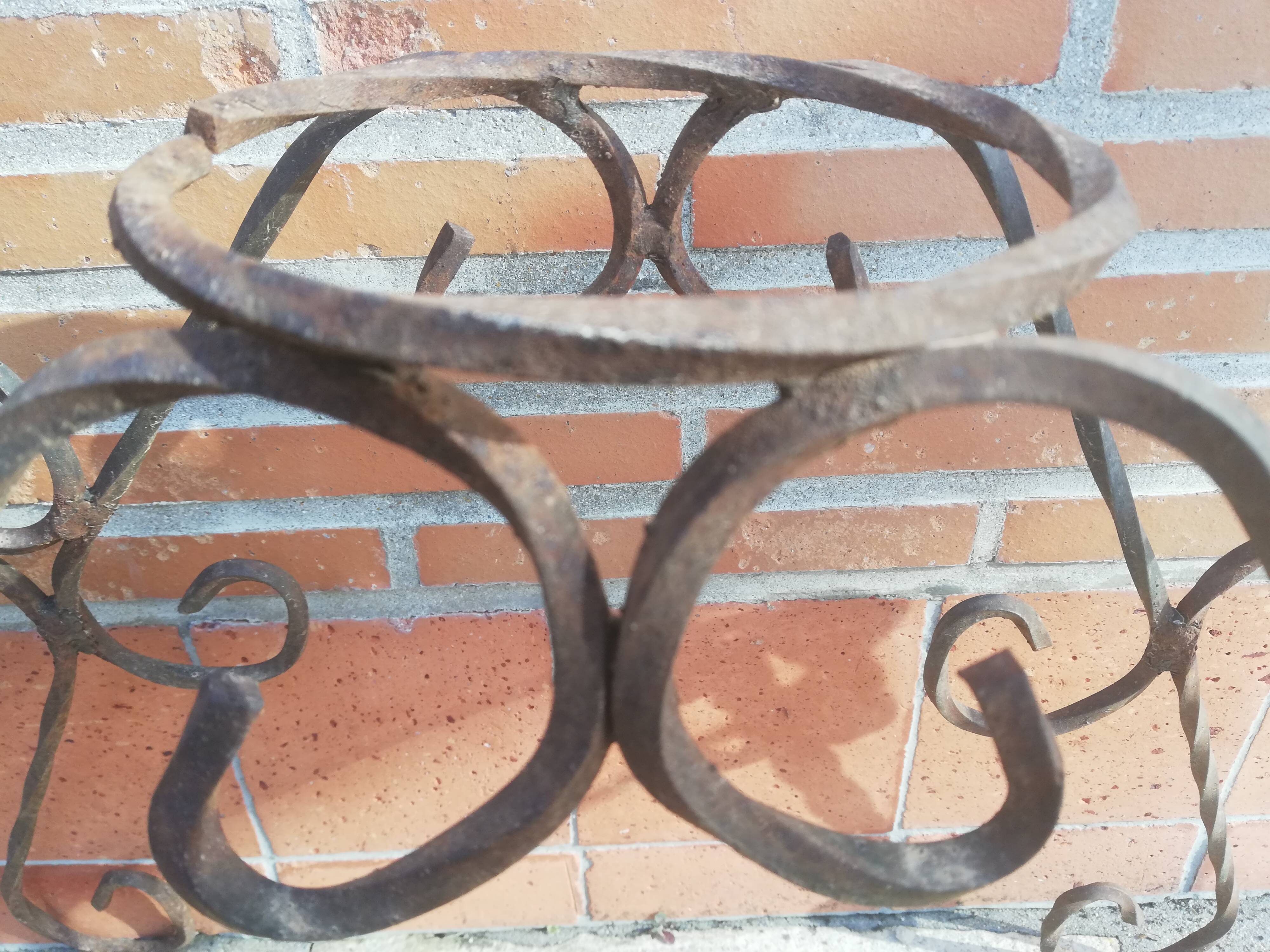 Wrought iron plant holders