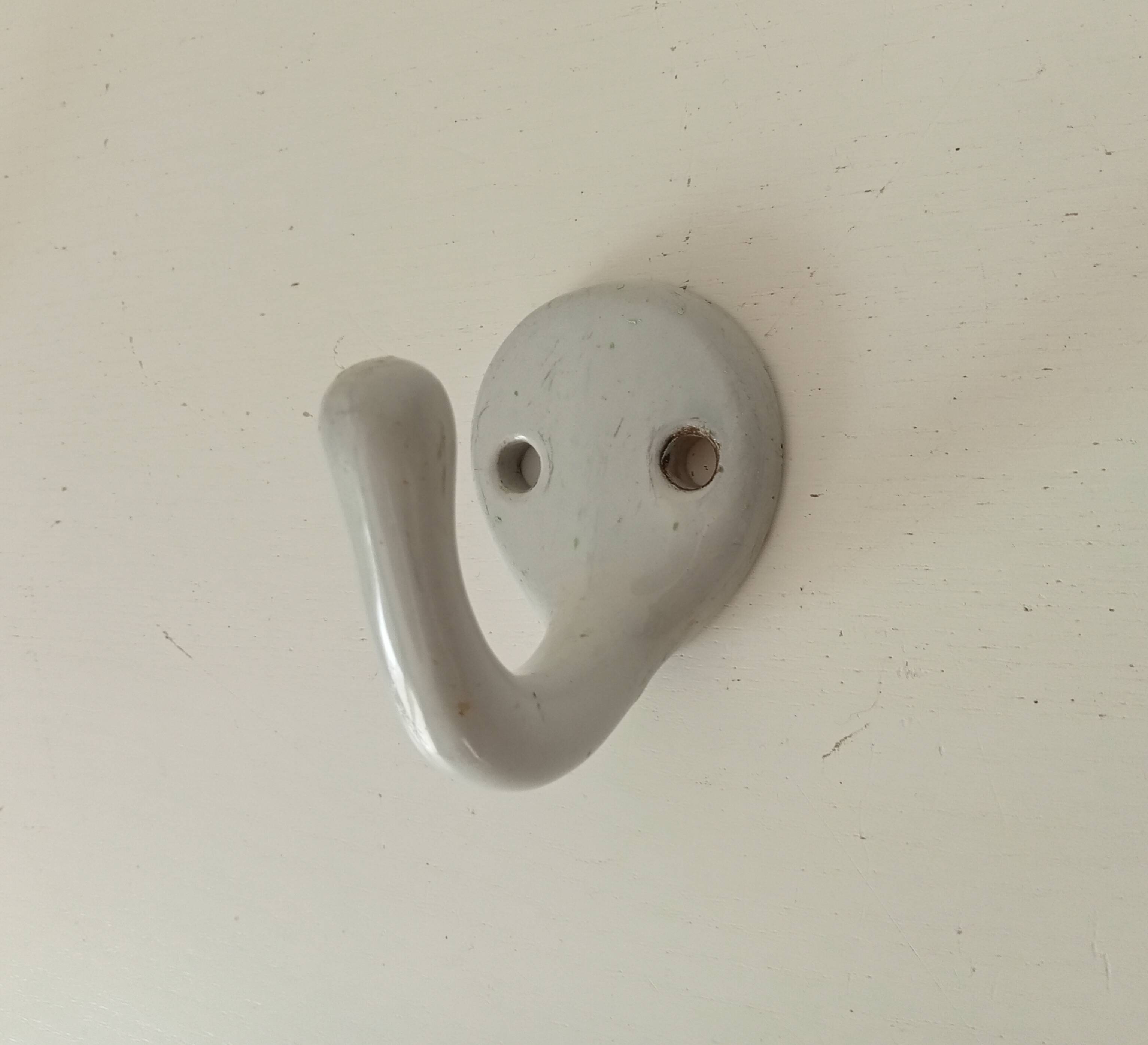 Antique enamelled cast iron wall hook from the 30s/40s