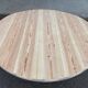 Scandinavian round dining table with a central base, stripped, made of solid raw wood, 90.