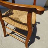 Grandfather's armchair in wood and straw.