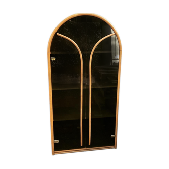 Curved bamboo and blond rattan library