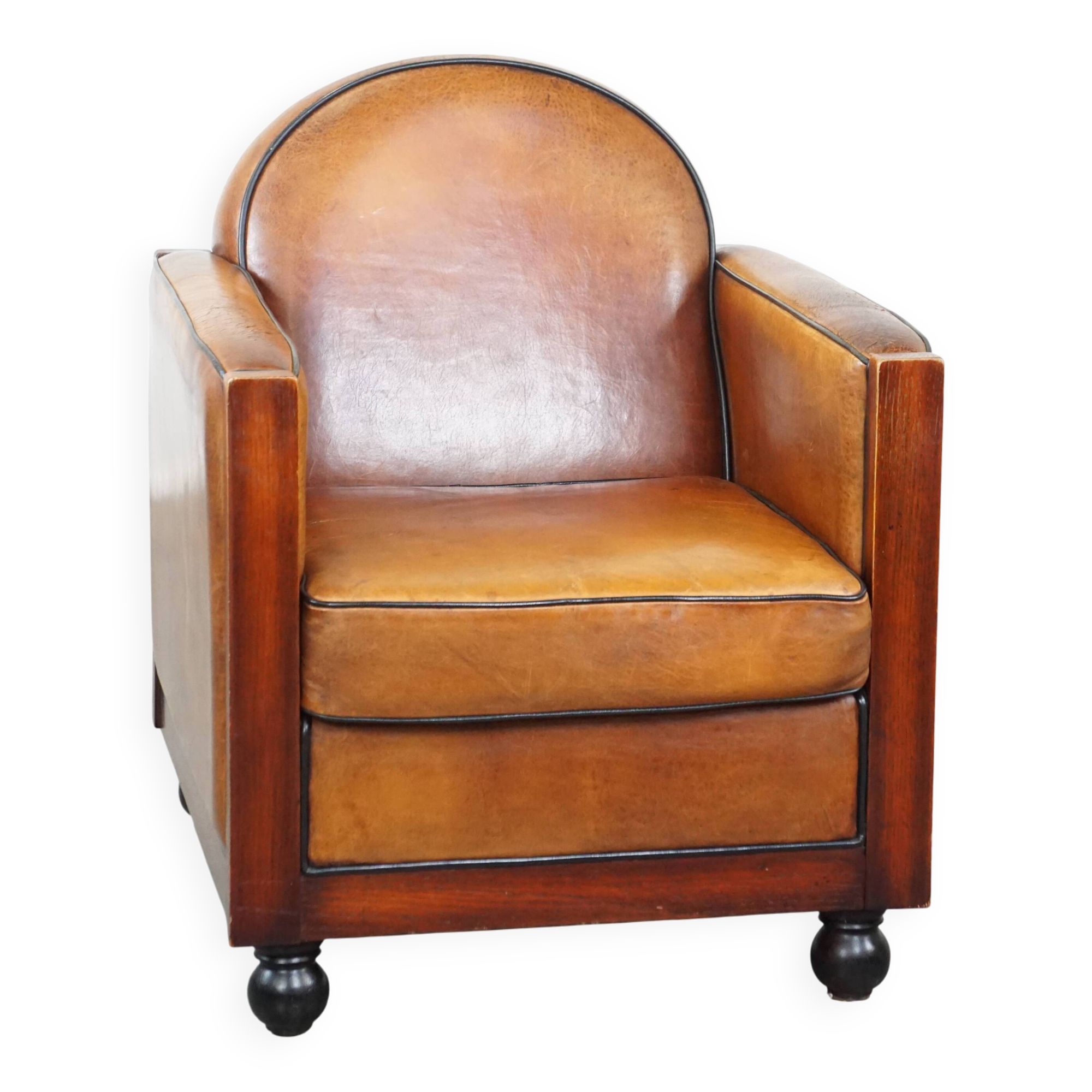 Sheep leather and wooden Art Deco design armchair with ball feet