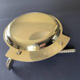 Round brass pocket tray with club and golf ball decoration.
