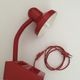 Articulated desk lamp with storage