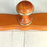 Wall-mounted coat rack in wood and brass