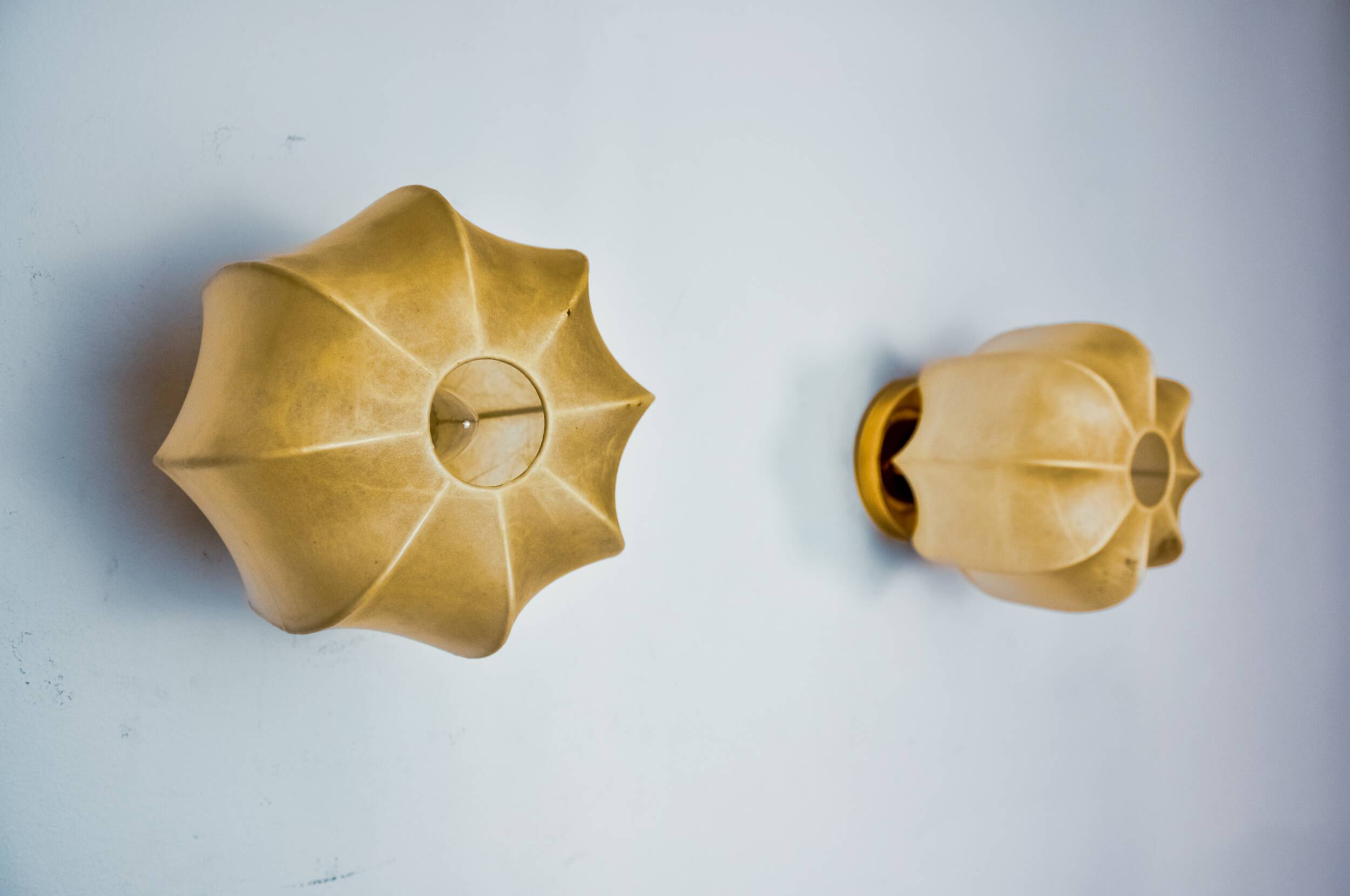 Pair of “cocoon” wall lights, resin and pine, italy, 1970