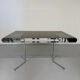 Smoked glass dining table with chrome legs, 1970s design by Roche Bobois.