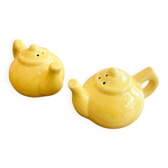 Salt and pepper shakers in the shape of a teapot.