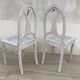 Pair of old white canne chairs