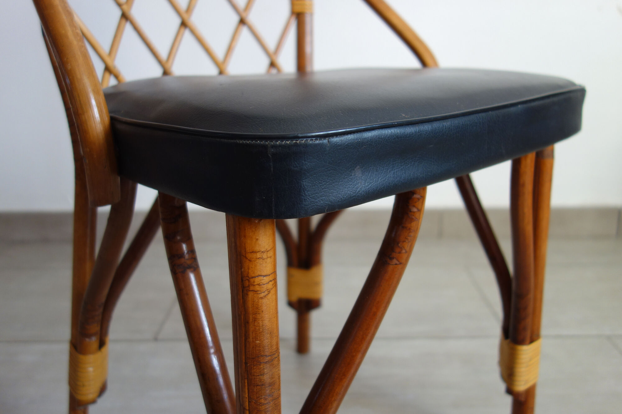 Pair of rattan and black skai bamboo chairs, 60s