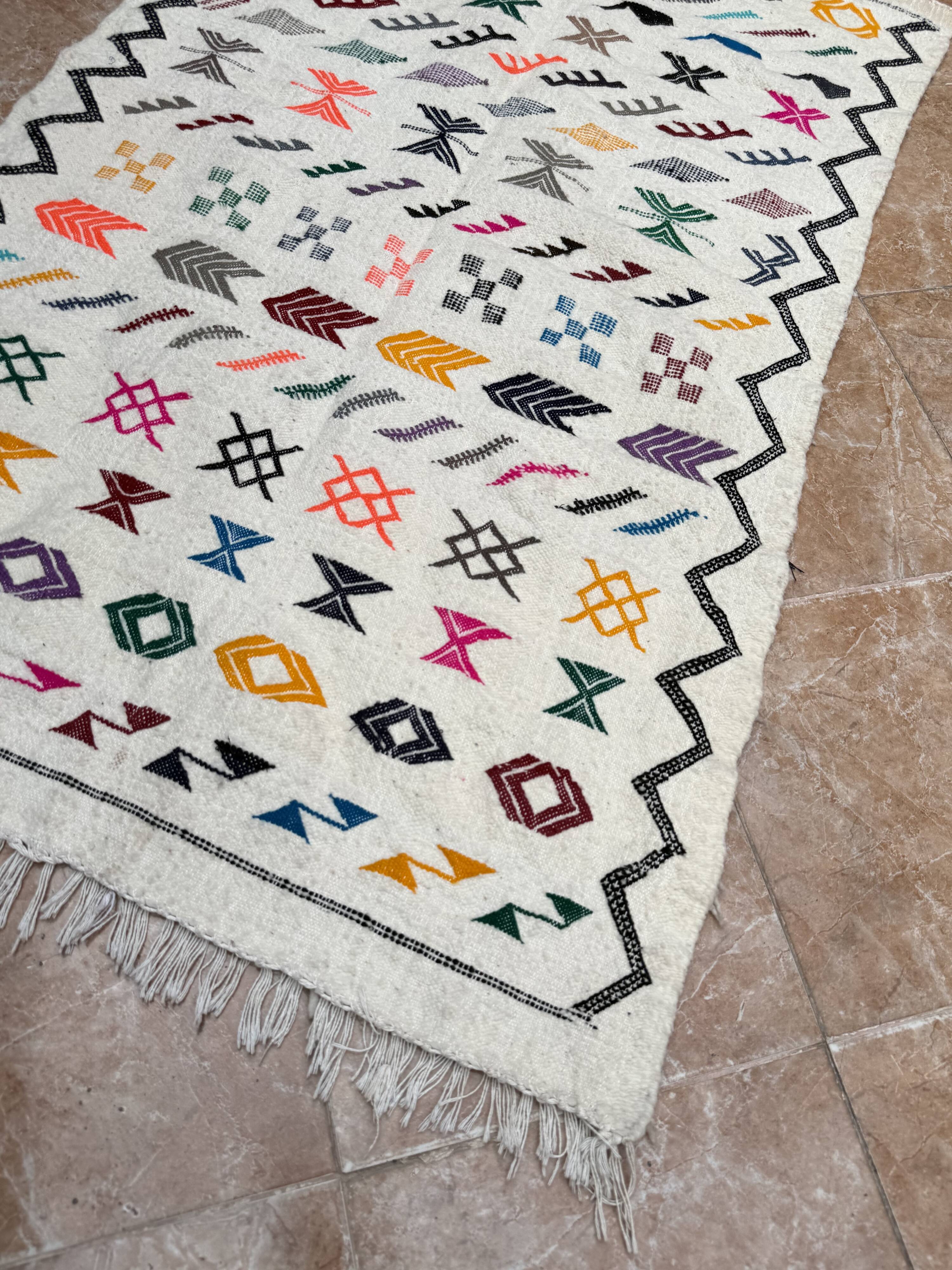 Handwoven Berber kilim rug: small Moroccan decorative rug.