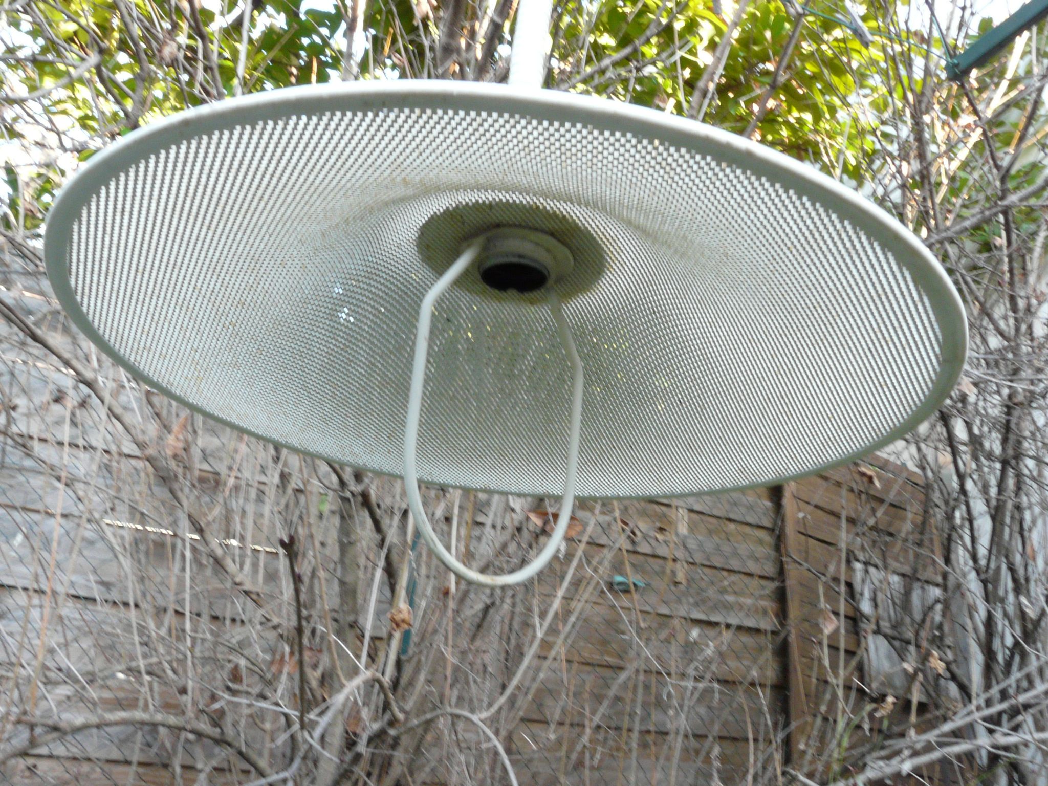 White perforated sheet metal chandelier